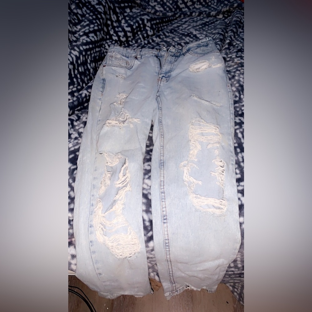 light blue baggy ripped jeans